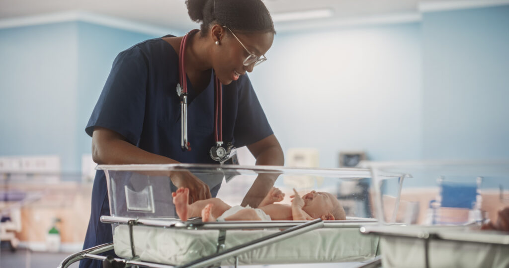 nurse with baby protected by infant RTLS
