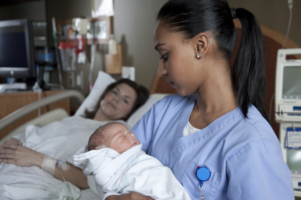 nurse with baby and mother
